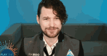 a man with a beard is wearing a vest that says rk800