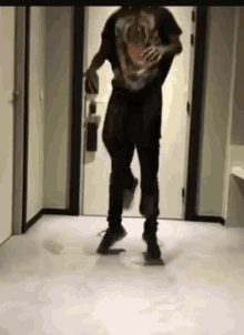 a man in a t-shirt with a skull on it is dancing