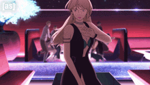 a woman in a black dress stands in front of a sign that says ' as '