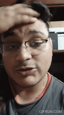 a close up of a man 's face with a gifrun.com watermark on the bottom