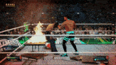 two wrestlers in a wrestling ring with a table on fire and a sign that says lemania