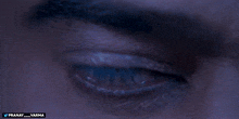 a close up of a man 's eye with the name pranay on the bottom right