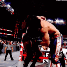Lashley Spinebuster Through Announcers Desk Rollins GIF - Lashley Spinebuster Through Announcers Desk Rollins GIFs