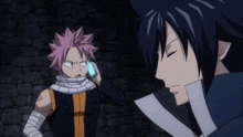 a couple of anime characters standing next to each other one of whom is talking on a phone
