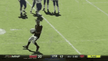 a football game between uta and flag is being shown on a television screen