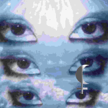 a close up of a person 's eyes with a crescent moon in the middle of them .