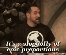 a man wearing a black shirt with a hammer on it says it 's a sloppy of epic proportions .