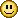 a pixelated smiley face with two black eyes and a smile