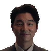 a man in a suit and white shirt is smiling