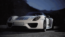 a white sports car with martini written on it