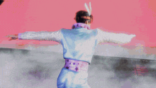 a pixelated image of a person in a blue and white suit