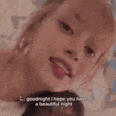 a woman is laying on a bed and says goodnight i hope you have a beautiful night