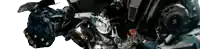 a close up of a motorcycle engine with a clock on it