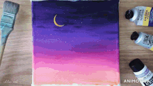 a painting of a sunset with a crescent moon and bottles of winsor and newton acrylic paint