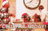 a man in a santa hat is standing next to a boy in a kitchen with the words crush it today .