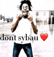 a man is standing in front of a sign that says `` do n't sybau '' .