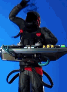 a man in a helmet is standing next to a table with a remote control on it .