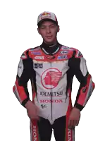 a motorcycle racer wearing a red bull hat and a honda jacket