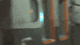 a silhouette of a woman walking through a hallway with a sign that says ' emergency exit '