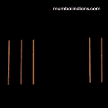 a man with his arms crossed is wearing a shirt that says mumbaiindians.com