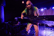 a man in a colorful shirt is being lifted up by a crowd