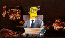 a man in a suit and tie is tied up and holding a nokia phone