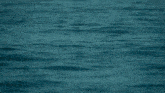 a large body of water with waves coming in from the side