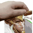 a hand is holding a picture of a man 's face .