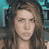 a close up of a woman wearing headphones