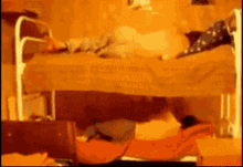 a blurry picture of a person laying on a bed in a room