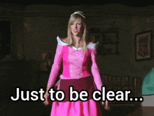 a woman in a pink dress with the words just to be clear below her