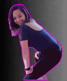 a woman in a black top and black pants is kneeling down