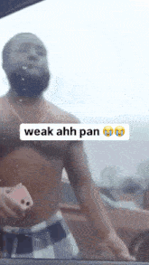 a shirtless man is standing in front of a car with the words weak ahh pan written above him