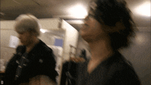 a blurry photo of a man with the letter d in the corner
