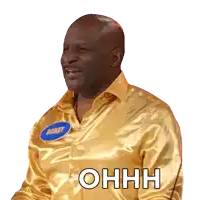 a man in a gold shirt with a name tag that says boast