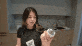 a person is holding a can that says 5 % alc / vol