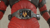 a close up of a person wearing a red belt with a dragon on it .