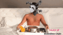 a shirtless man is sitting on a bed with a tray of food with the words wake up call maleficus origin on the bottom right