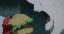 a close up of a person eating a hamburger with lettuce and meat .