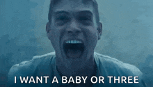 a man is screaming with his mouth wide open and the words `` i want a baby or three '' written below him .