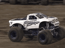a white monster truck with the word ram on it