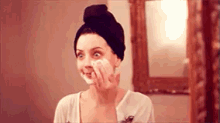 Putting On Face Mask GIF - Pampered Face Mask Night In GIFs
