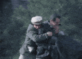 a group of men are standing around a man with a broken arm