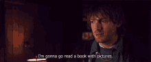a man says i 'm gonna go read a book with pictures in a dark room