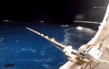 a boat is floating on top of a body of water with the hashtag @linn on the bottom