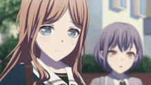 a girl with long brown hair and blue eyes is standing next to another girl