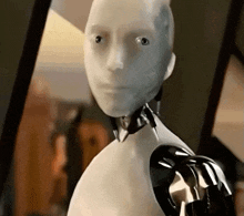 a close up of a robot 's face and arms