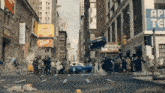a crowd of people are gathered on a city street in front of a sign that says ' ad tech '