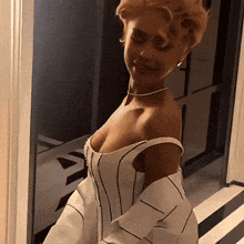 a woman in a white striped dress is standing in a hallway