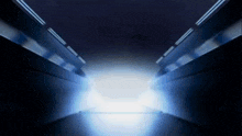 a futuristic tunnel with a light at the end